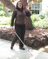 Student on campus with cane