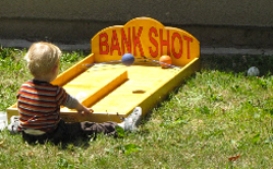Boy playing Bank Shot game