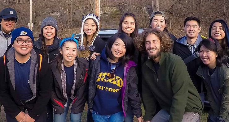 UC San Diego students on an alternative break trip pose as a group