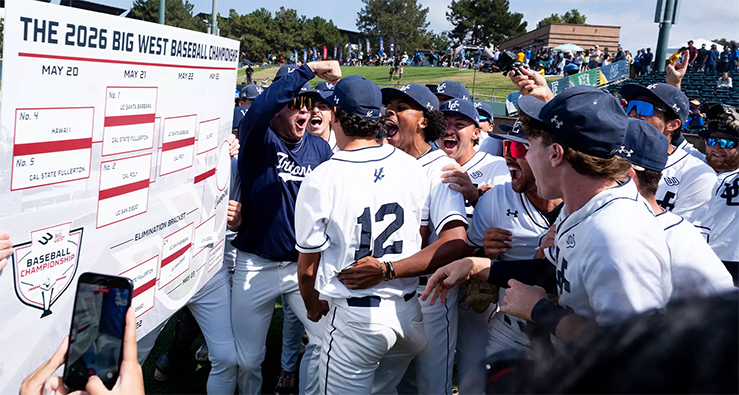 UCSD Triton baseball team celebrates in front of the B