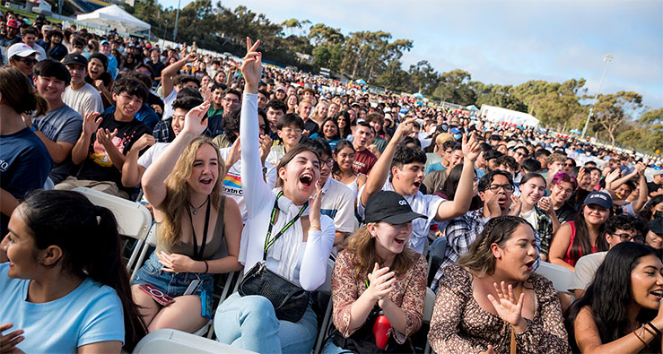 UC San Diego students in Convocation 2022 audience - cheering, smiling