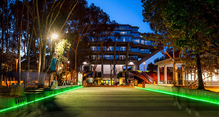 UC San Diego Library Walk - lit with green lights for Mental Health Awareness Month