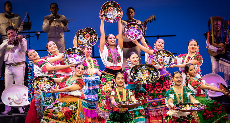 Nochebuena - Ballet Folklorico performers in colorful costumes on stage