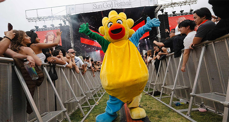 UCSD's Sun God mascot strolls through the crowd at Sun God Festival 2025