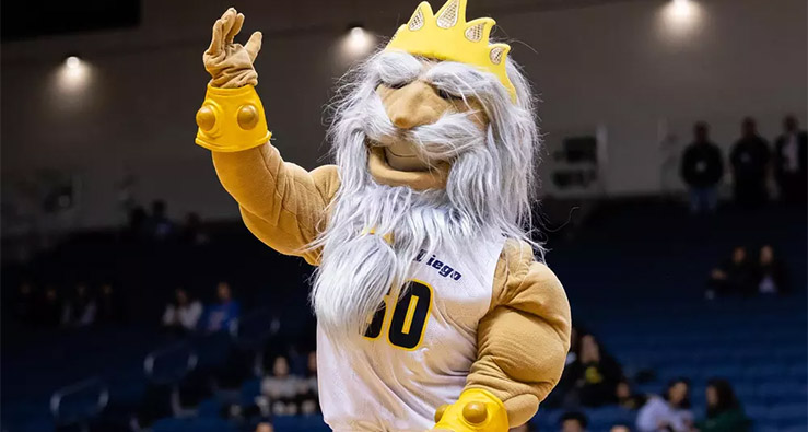 UCSD Triton mascot waves from the court at RIMAC