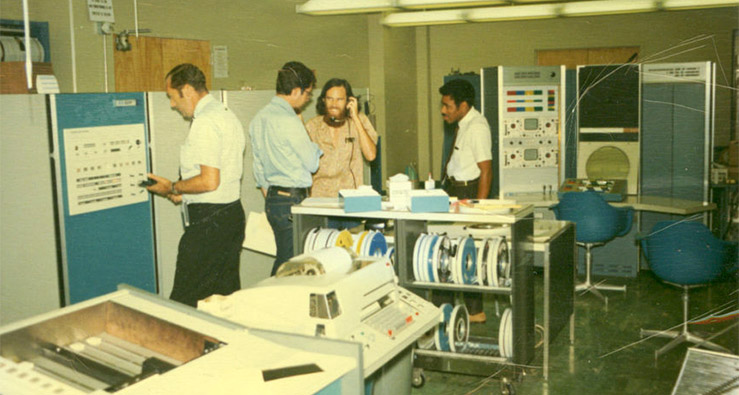 Vintage-tinted photo of scientists in UCLA computer lab